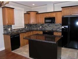 You will notice the lovely granite counters , high ceilings and ample cabinet