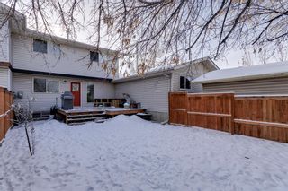 Photo 34: 322 Woodvale Crescent SW in Calgary: Woodlands Row/Townhouse for sale : MLS®# A2015272