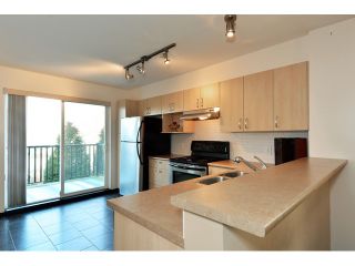 Photo 3: 34 15155 62A Avenue in Surrey: Sullivan Station Townhouse for sale in "Oaklands in Panorama Place" : MLS®# F1431470