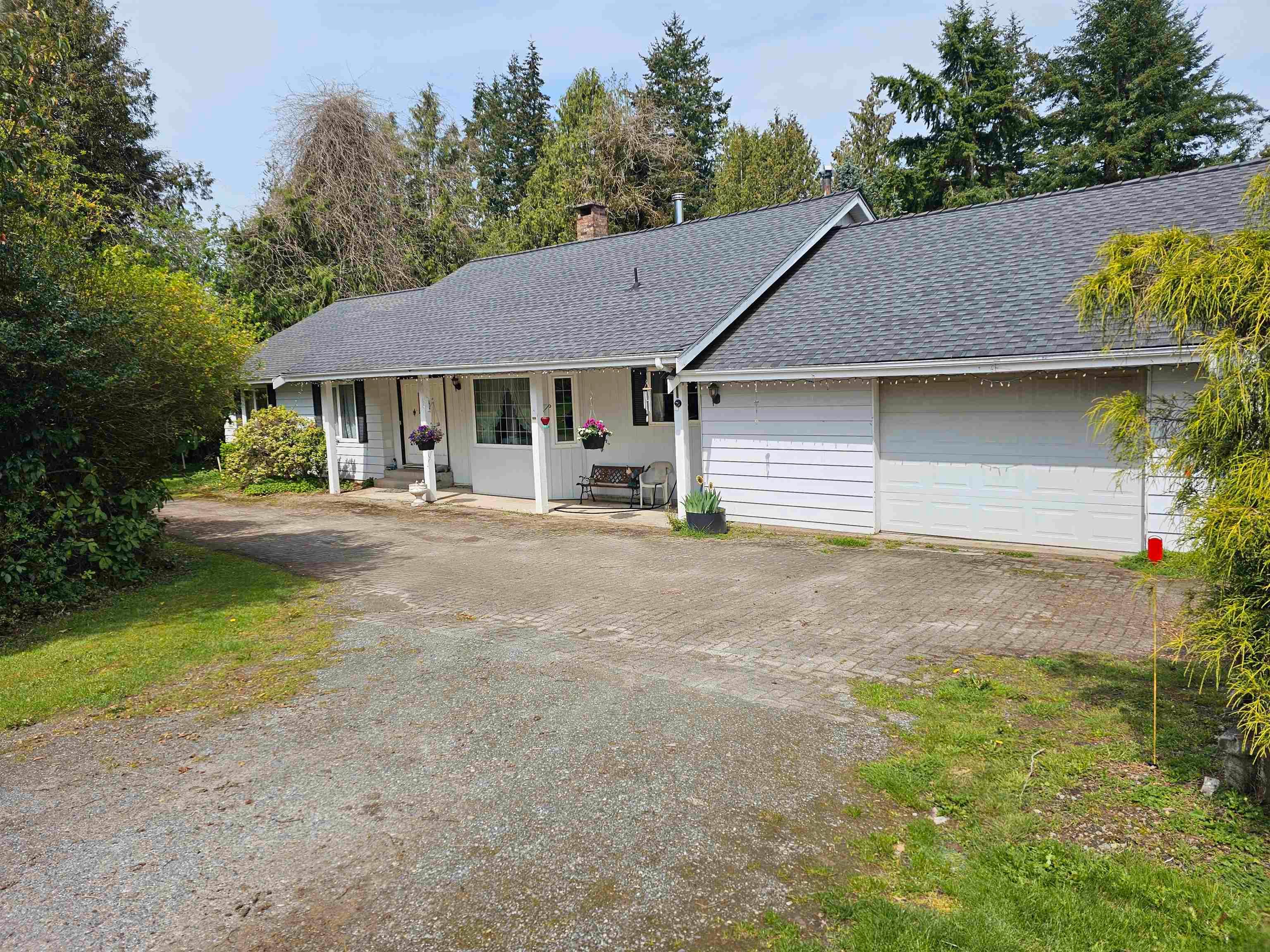 Main Photo: 23415 34A Avenue in Langley: Campbell Valley House for sale : MLS®# R2774852