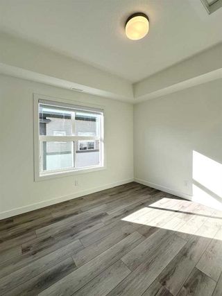 Photo 11: 128 Spring Creek Common SW in Calgary: Springbank Hill Row/Townhouse for sale : MLS®# A2109387