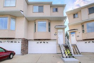 Photo 1: 121 Country Hills Gardens NW in Calgary: Country Hills Row/Townhouse for sale : MLS®# A1057496