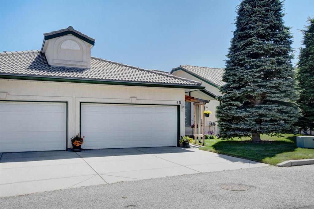 Main Photo: 65 Strathearn Gardens SW in Calgary: Strathcona Park Semi Detached for sale : MLS®# A1240835