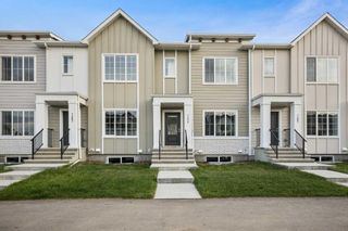 Photo 1: 7475 202 Avenue SE in Calgary: C-390 Row/Townhouse for sale : MLS®# A2079882