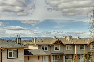 Photo 17: 1 172 Rockyledge View NW in Calgary: Rocky Ridge Row/Townhouse for sale : MLS®# A1218790