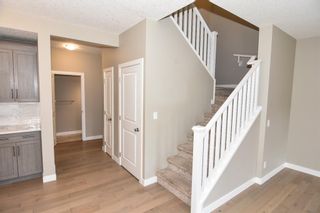 Photo 4: 215 Kinniburgh Road: Chestermere Semi Detached for sale : MLS®# A1237068