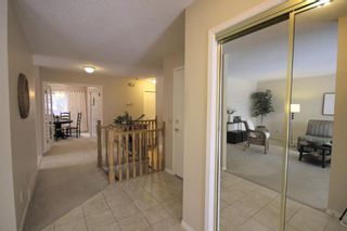 Photo 2: 15 Coach Side Terrace SW in Calgary: Coach Hill Row/Townhouse for sale : MLS®# A1071978