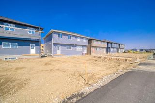 Photo 34: 306 Creekside Boulevard SW in Calgary: C-168 Semi Detached (Half Duplex) for sale : MLS®# A1254336