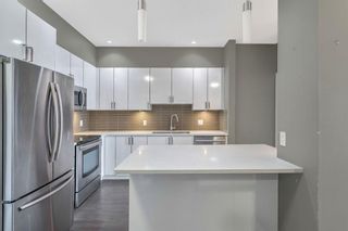 Photo 3: 405 28 Auburn Bay Link SE in Calgary: Auburn Bay Apartment for sale : MLS®# A1231846
