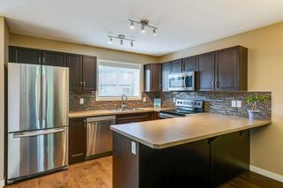 Photo 2: 63 Sunset Road: Cochrane Row/Townhouse for sale : MLS®# A2139439