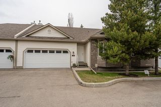 Photo 1: 18 Mt Douglas Villas SE in Calgary: McKenzie Lake Row/Townhouse for sale : MLS®# A2054384