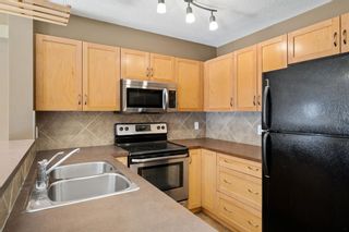 Photo 11: 8113 70 Panamount Drive NW in Calgary: Panorama Hills Apartment for sale : MLS®# A1259466