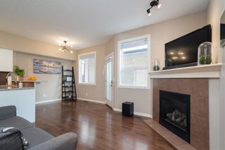 Photo 3: 151 23 Avenue NW in Calgary: Tuxedo Park Row/Townhouse for sale : MLS®# A2047705