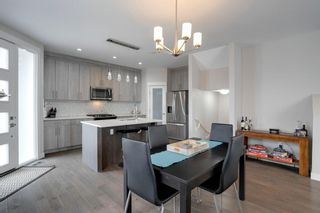 Photo 2: 2 4507 Bowness Road NW in Calgary: Montgomery Row/Townhouse for sale : MLS®# A1192631