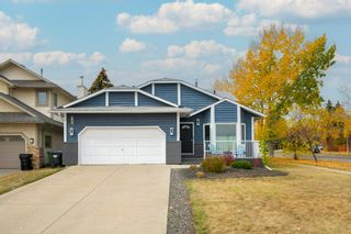 Photo 1: 204 Strickland Bay SW in Calgary: Strathcona Park Detached for sale : MLS®# A2006662
