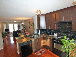 Photo 3: 203 2445 KINGSLAND Road SE: Airdrie Townhouse for sale : MLS®# C3603251