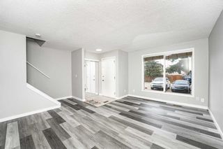 Photo 2: 1040 3235 56 ST in Calgary: Pineridge Row/Townhouse for sale : MLS®# A2129625
