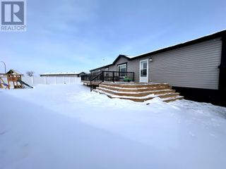 Photo 24: 147 Meadowplace Drive E in Brooks: House for sale : MLS®# A2030978