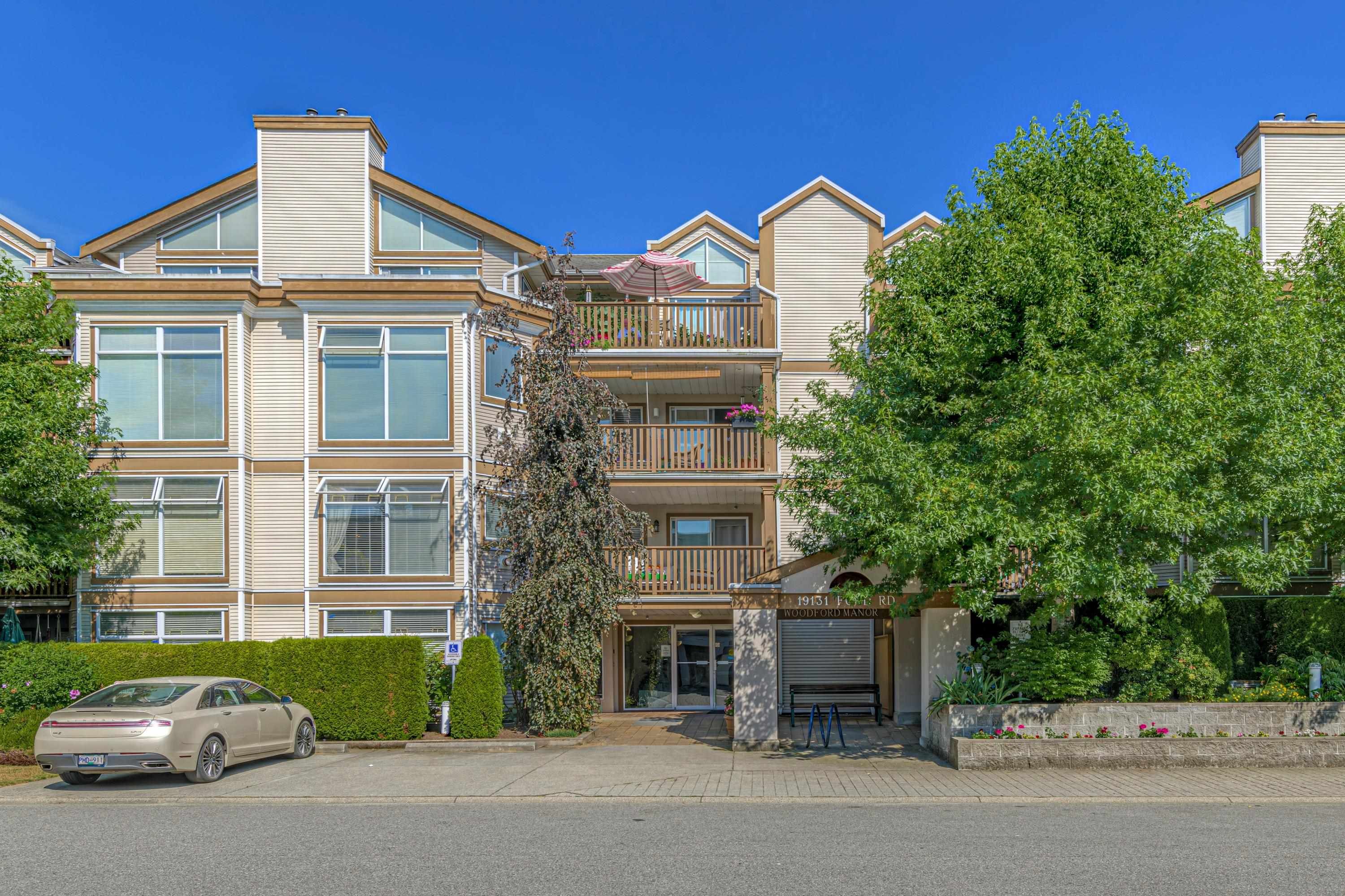 Main Photo: 209 19131 FORD Road in Pitt Meadows: Central Meadows Condo for sale in "WOODFORD MANOR" : MLS®# R2714496