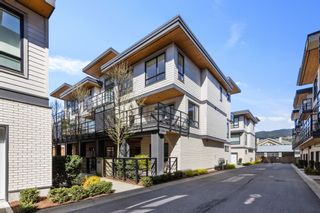Photo 1: 105 2565 RUNNEL Drive in Coquitlam: Eagle Ridge CQ Townhouse for sale in "Dwell" : MLS®# R2676300