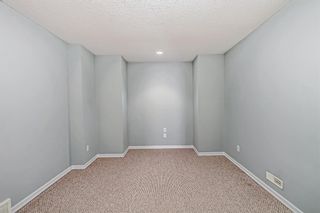 Photo 34: 8 220 Bow Ridge Court: Cochrane Semi Detached (Half Duplex) for sale : MLS®# A2026724