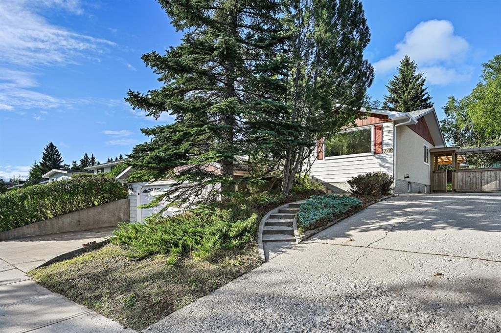 Side Driveway or RV parking. Stairwell to front deck and entrance.