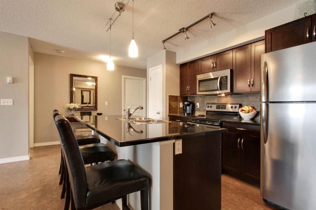 Main Photo: 323 250 New Brighton Villas SE in Calgary: New Brighton Apartment for sale : MLS®# A1195613